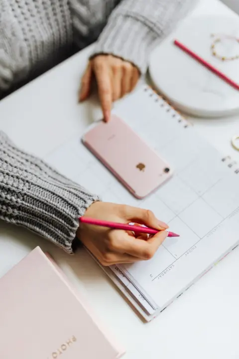 A person planning a schedule on paper