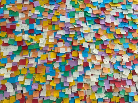 Colorful sticky notes arranged on a wall