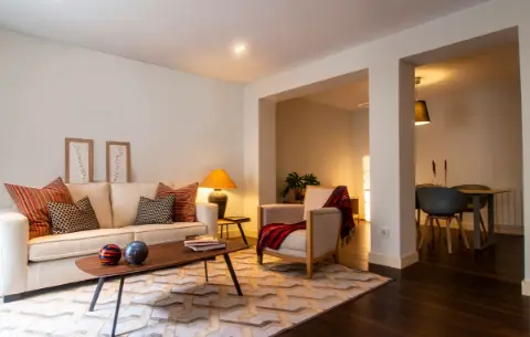 A warmly lit living room, an easy first location to picture in detail